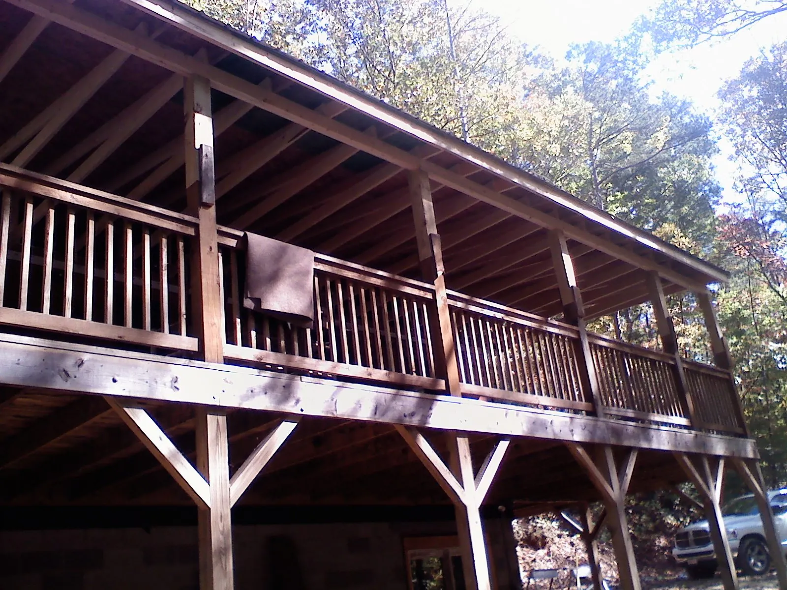 Timber framing under a new elevated porch and deck — Roof Leak Repair in Encampment by Roofing Brothers